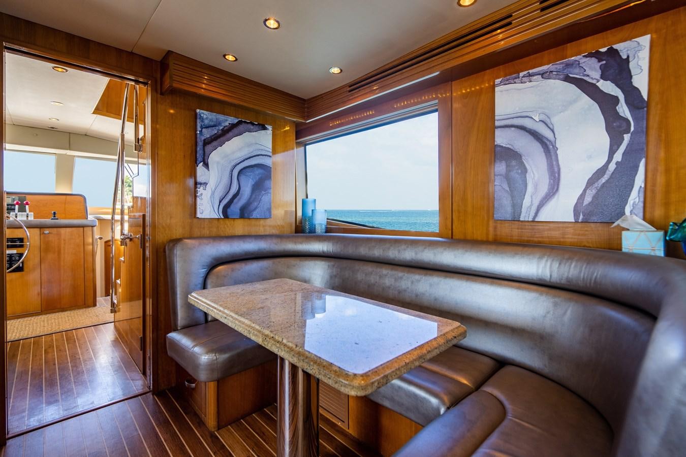 a living room with a couch and a table aboard DIAMOND LADY Yacht for Sale