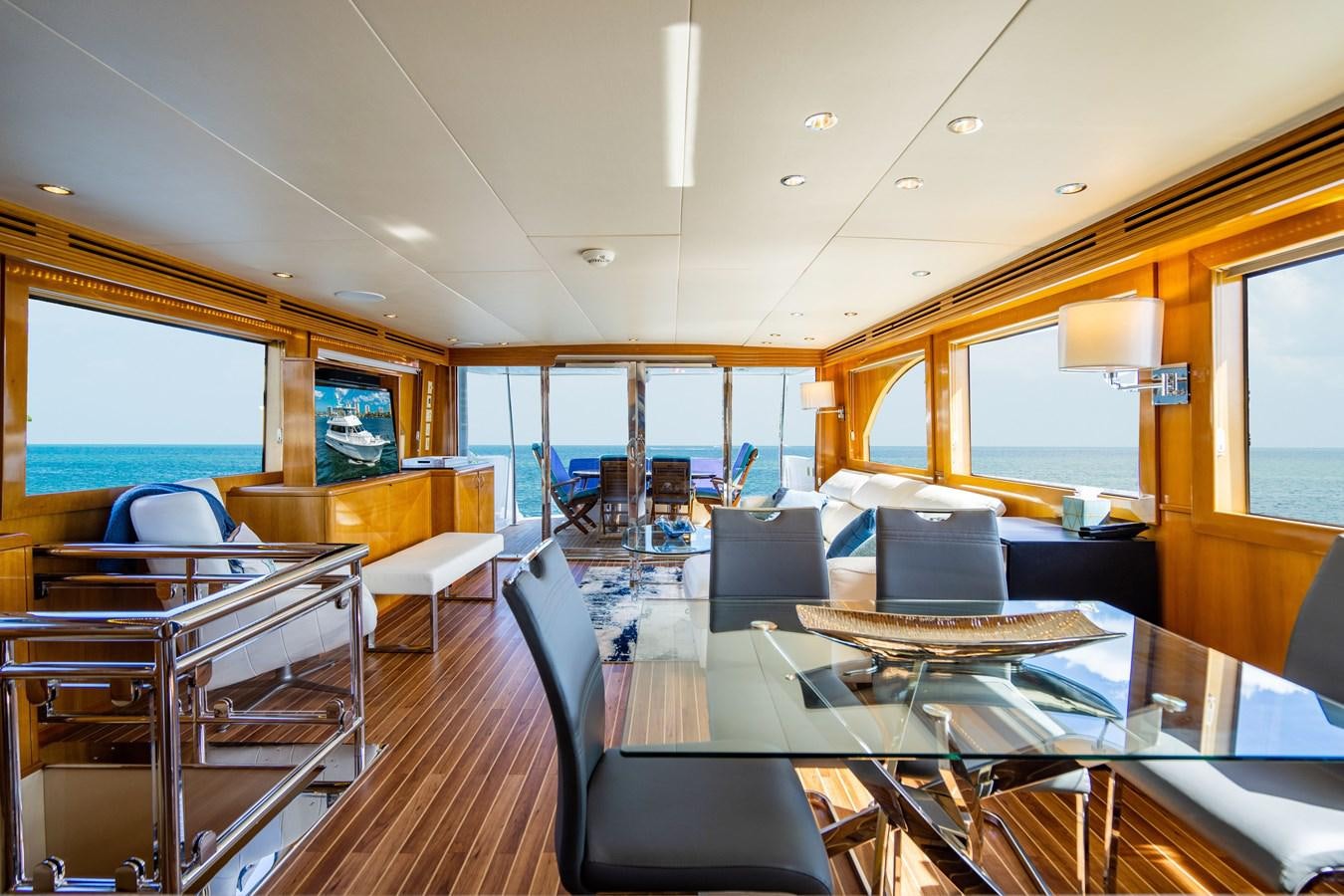 a room with a table and chairs aboard DIAMOND LADY Yacht for Sale