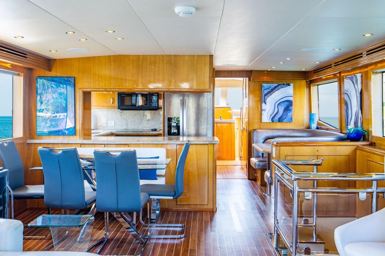 a room with chairs and tables aboard DIAMOND LADY Yacht for Sale