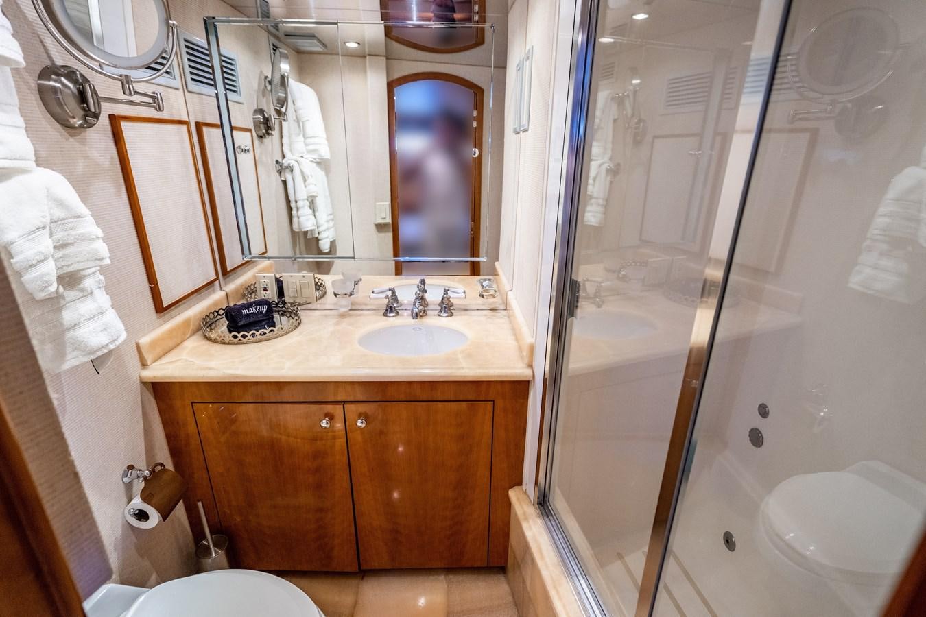 a bathroom with a sink and a shower aboard DIAMOND LADY Yacht for Sale