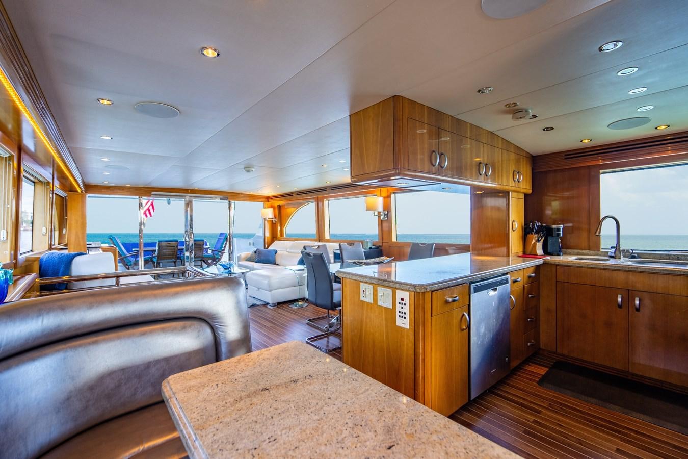 a large kitchen with a large open window aboard DIAMOND LADY Yacht for Sale
