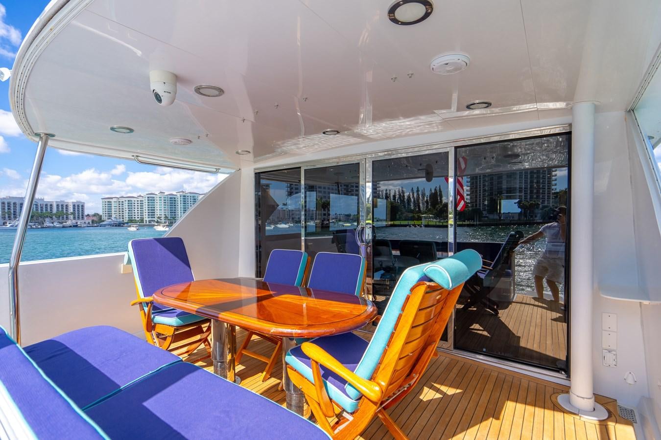 a room with a table and chairs aboard DIAMOND LADY Yacht for Sale