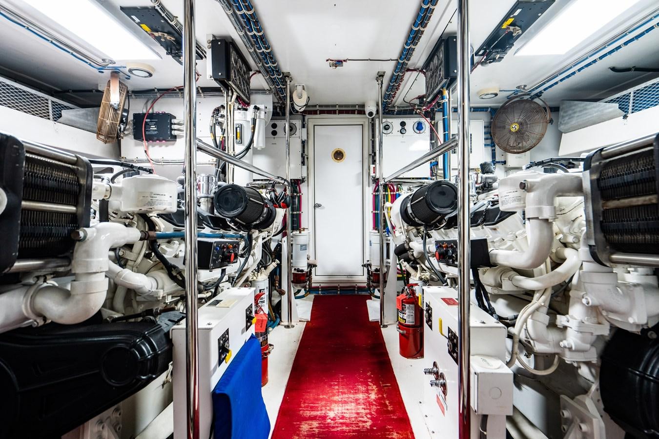 a room with white walls and red flooring aboard DIAMOND LADY Yacht for Sale