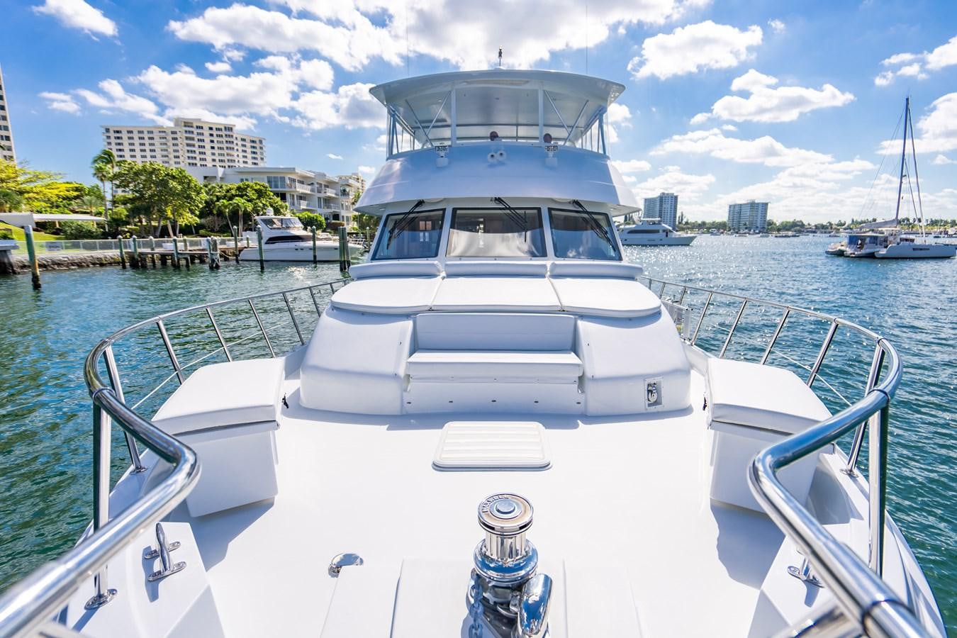 a boat docked at a pier aboard DIAMOND LADY Yacht for Sale