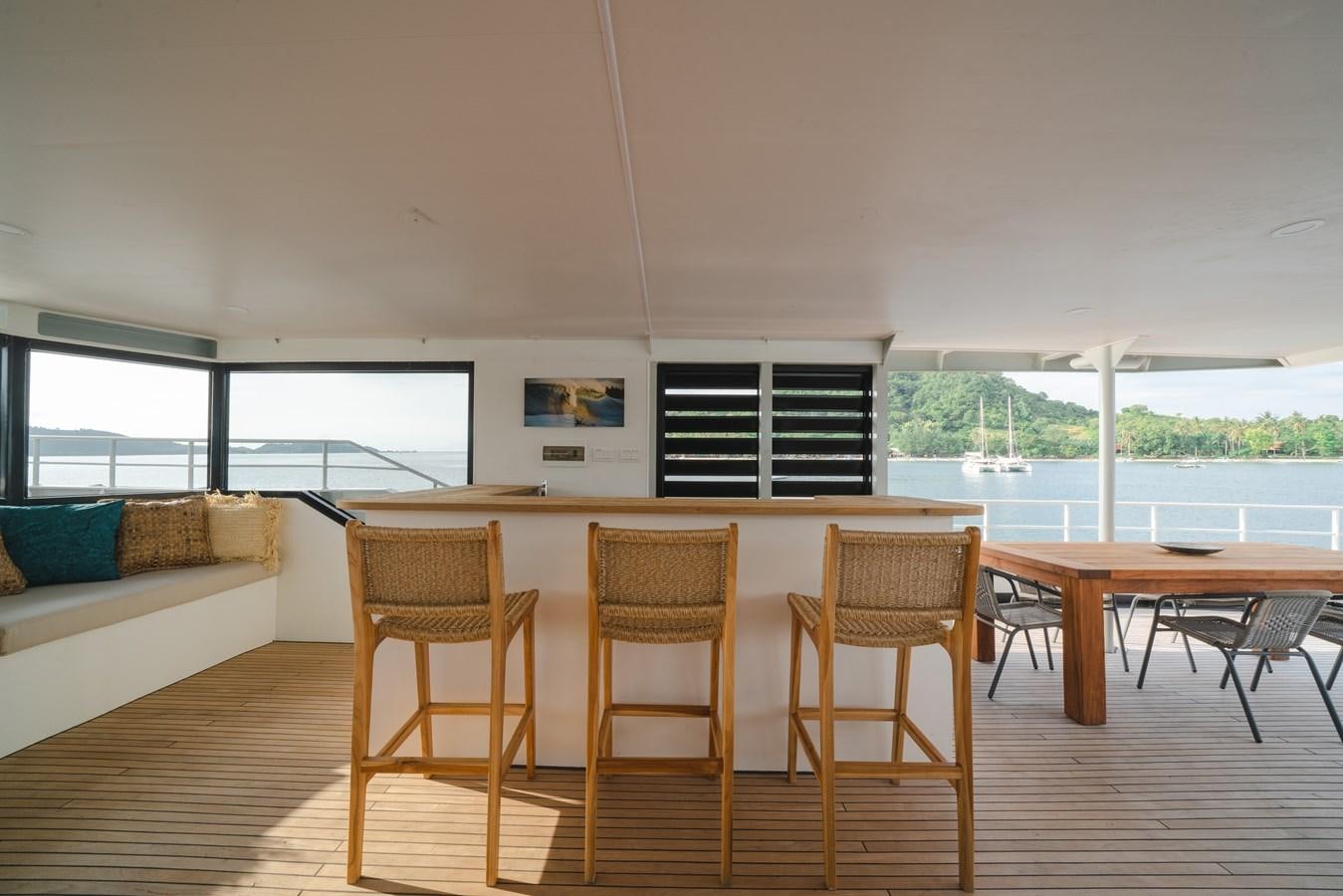 a room with a table chairs and a couch aboard SOUTHERN CROSS Yacht for Charter