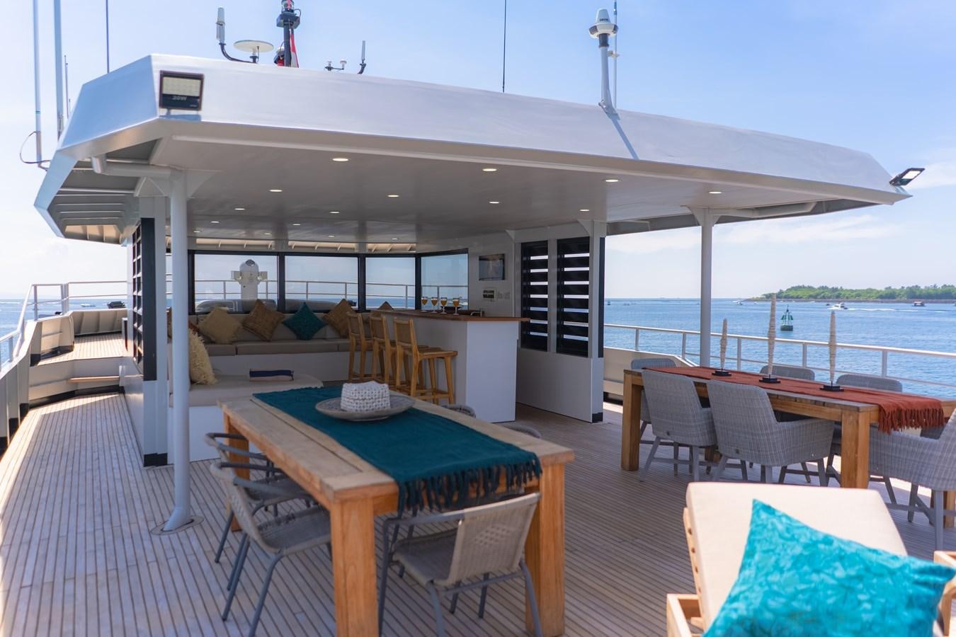 a boat with a table and chairs aboard SOUTHERN CROSS Yacht for Charter