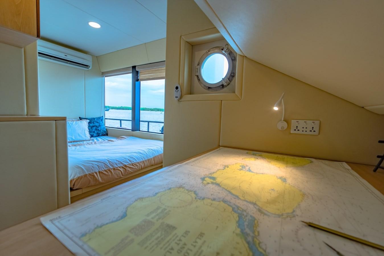 a bedroom with a large mirror aboard SOUTHERN CROSS Yacht for Charter
