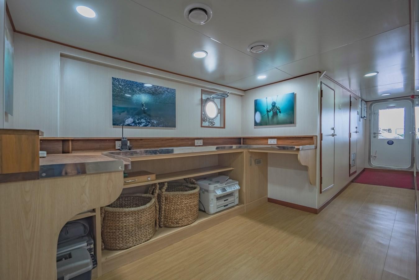 a kitchen with a large island aboard SOUTHERN CROSS Yacht for Charter