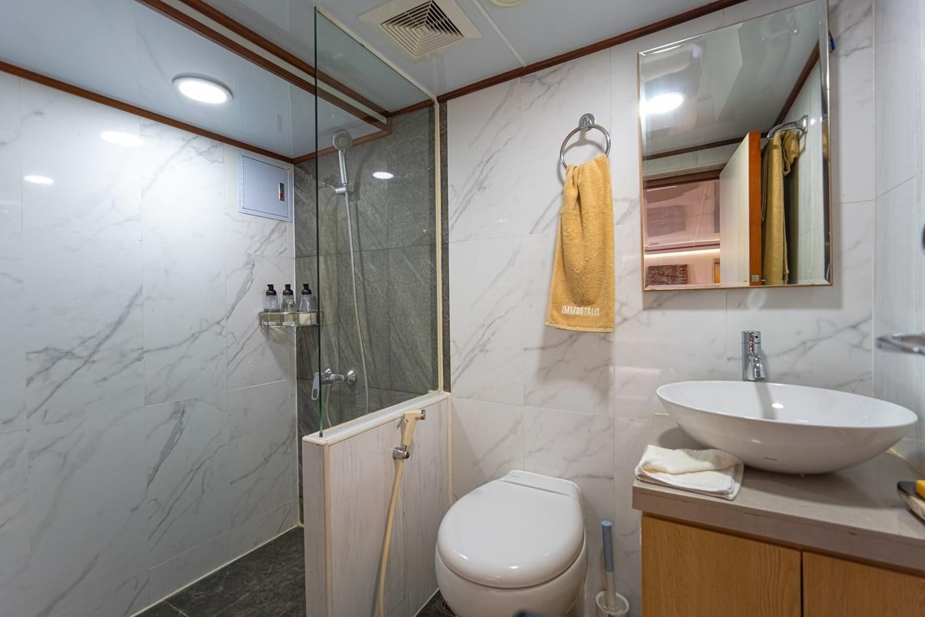a bathroom with a glass shower aboard SOUTHERN CROSS Yacht for Charter
