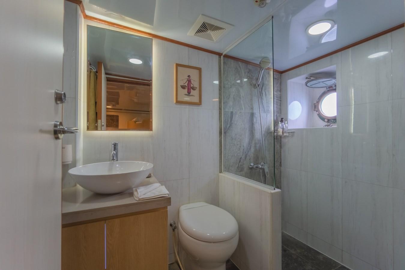 a bathroom with a sink toilet and bathtub aboard SOUTHERN CROSS Yacht for Charter