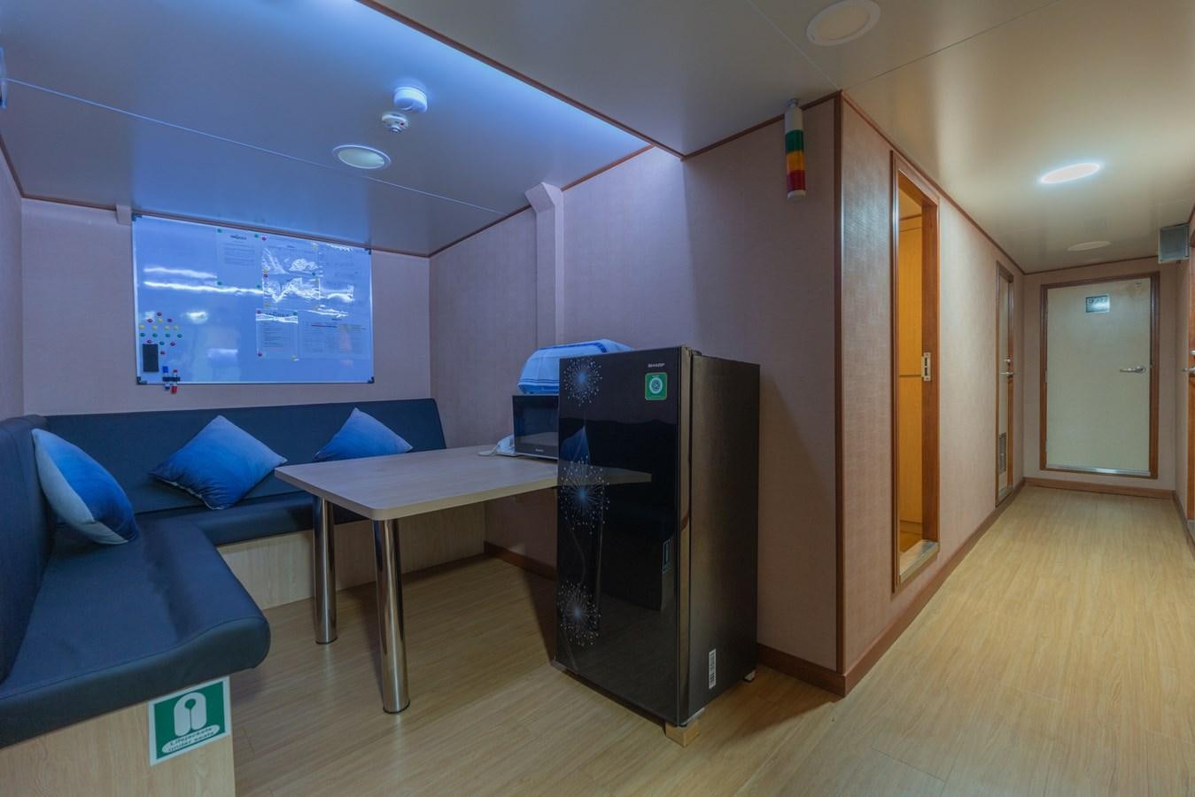a room with a desk and a bed aboard SOUTHERN CROSS Yacht for Charter
