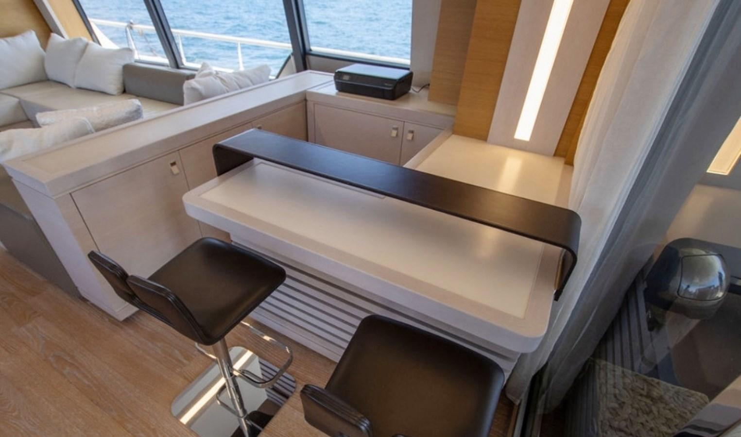 a room with a couch and a table aboard D'VINCI Yacht for Sale