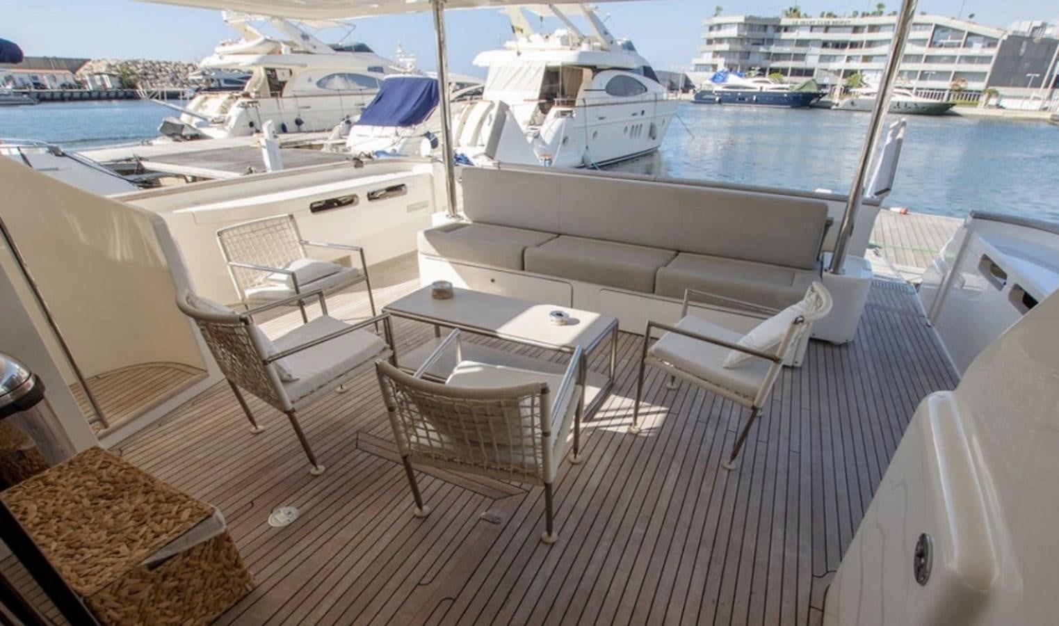a deck with chairs and tables on it aboard D'VINCI Yacht for Sale