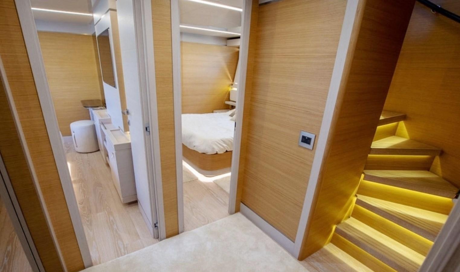 a room with a bed and a closet aboard D'VINCI Yacht for Sale