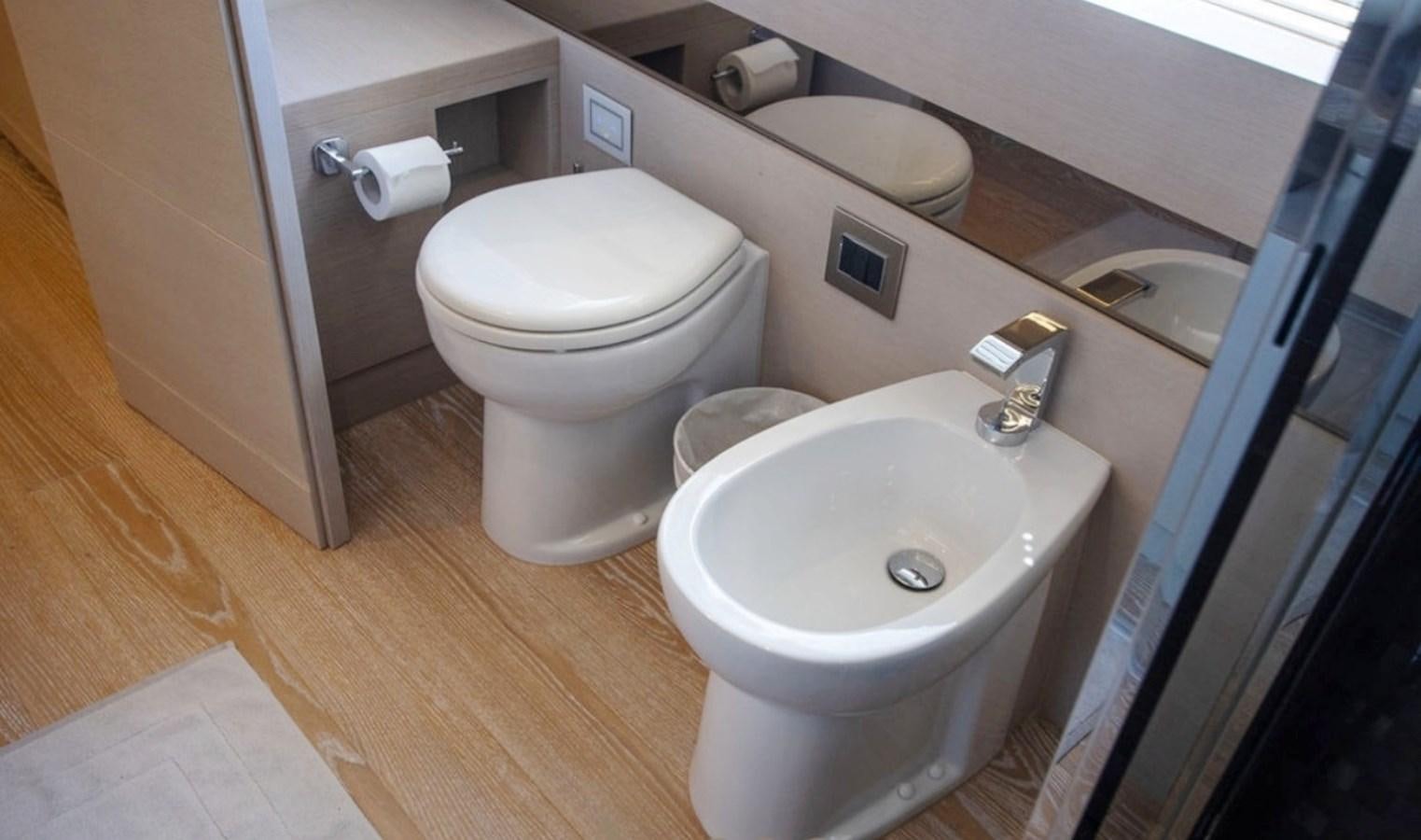 a toilet and sink in a bathroom aboard D'VINCI Yacht for Sale