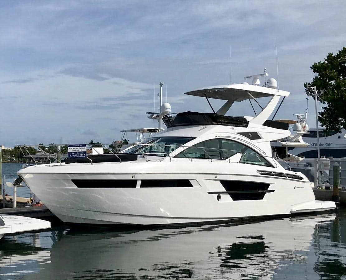 a white yacht in a harbor aboard 54 FLY Yacht for Sale
