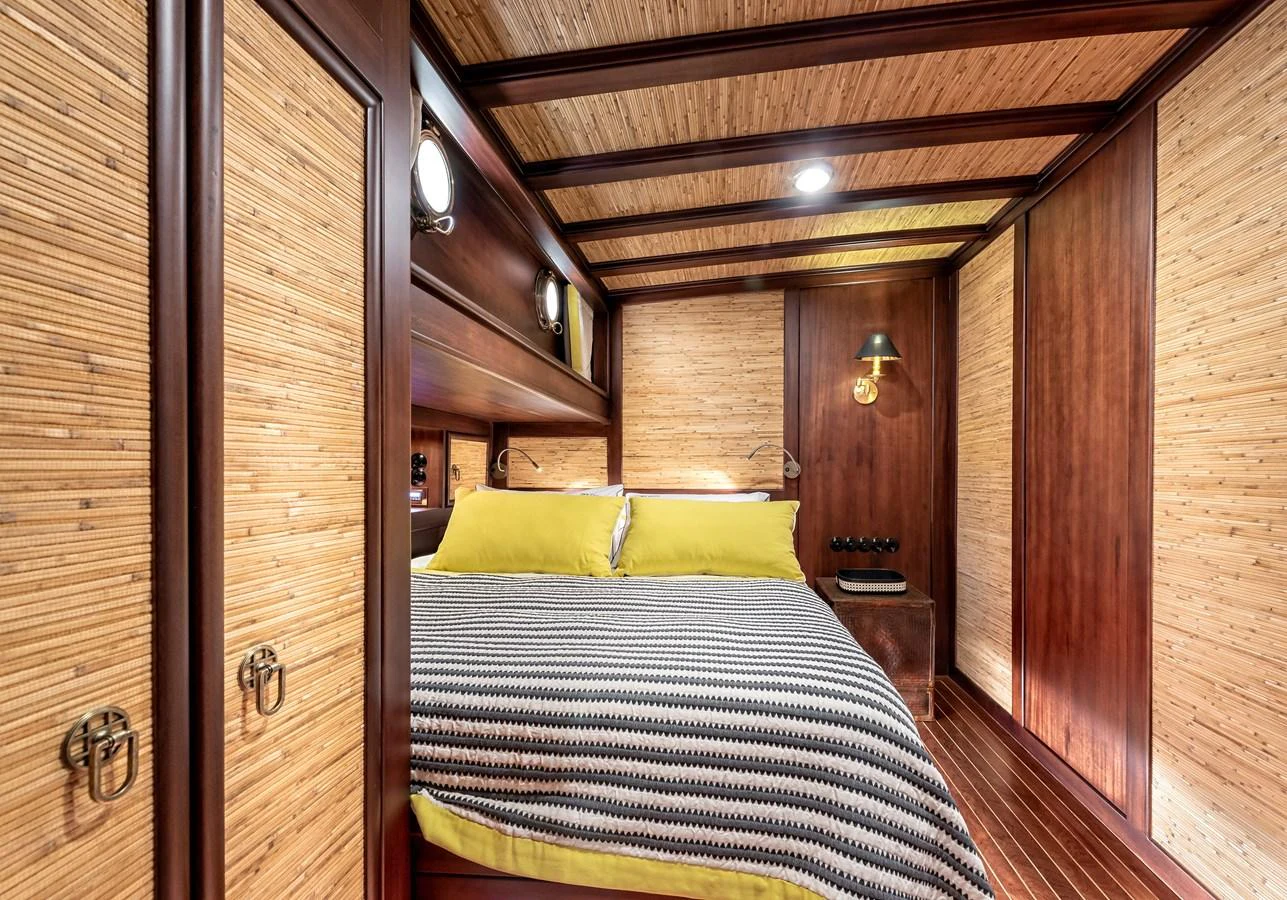 a bed in a room aboard CAPTAIN COOK Yacht for Sale