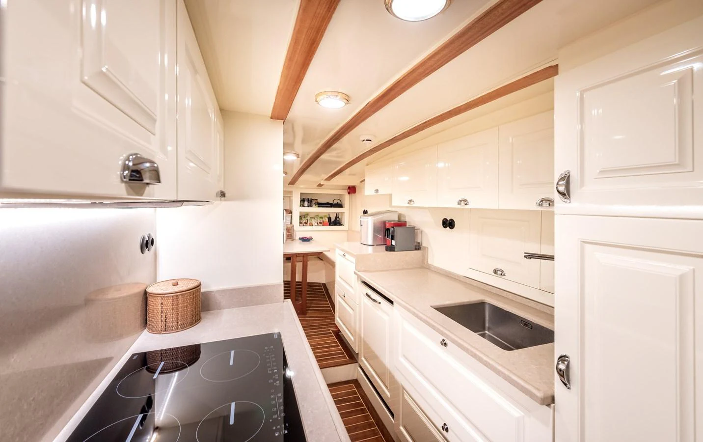 a kitchen with white cabinets aboard CAPTAIN COOK Yacht for Sale