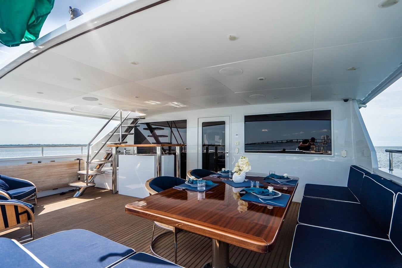 a room with a table and chairs aboard QUANTUM Yacht for Sale