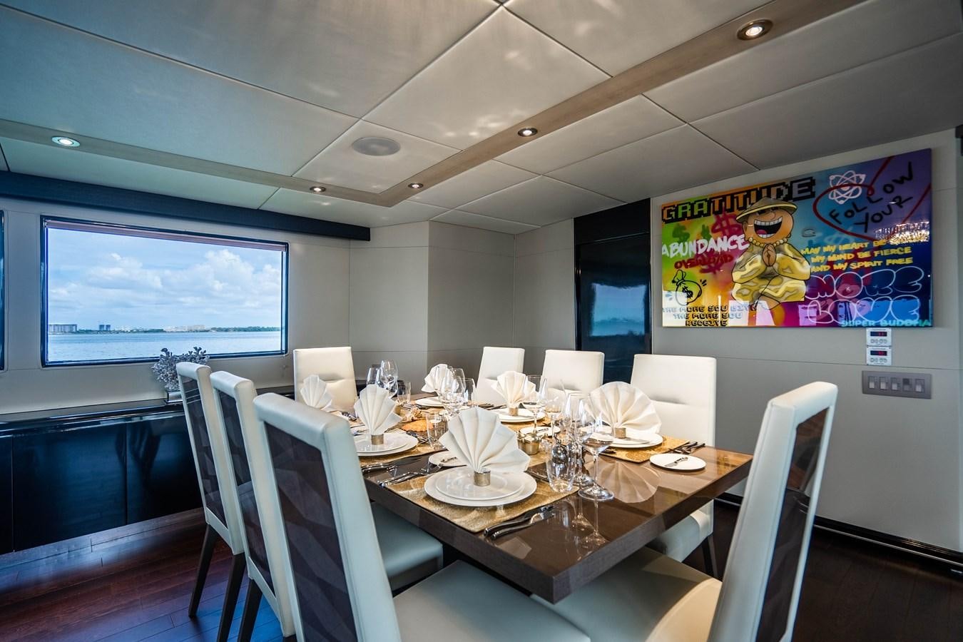 a conference room with tables and chairs aboard QUANTUM Yacht for Sale