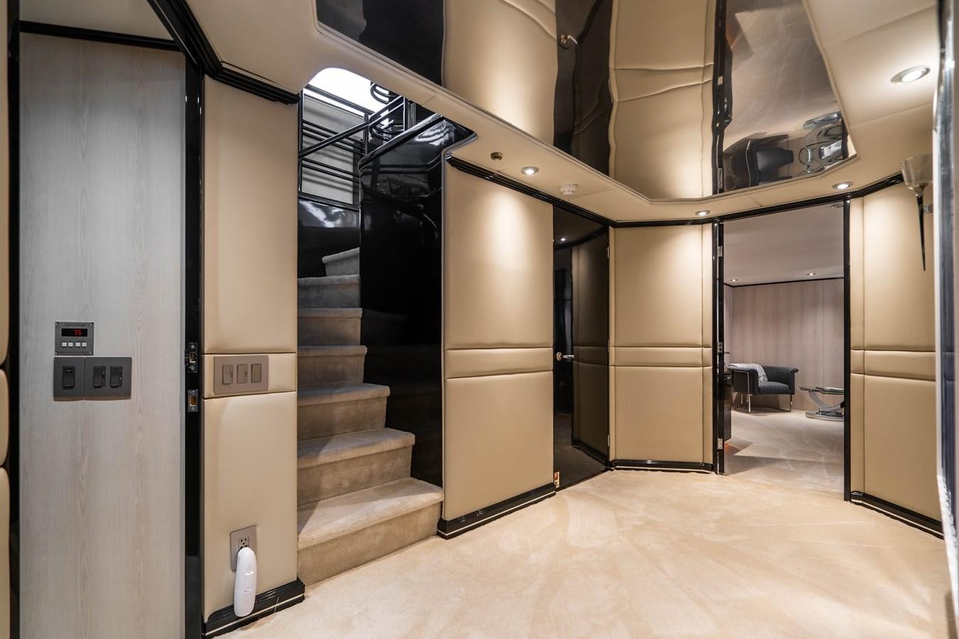 a room with a staircase and a large metal door aboard QUANTUM Yacht for Sale