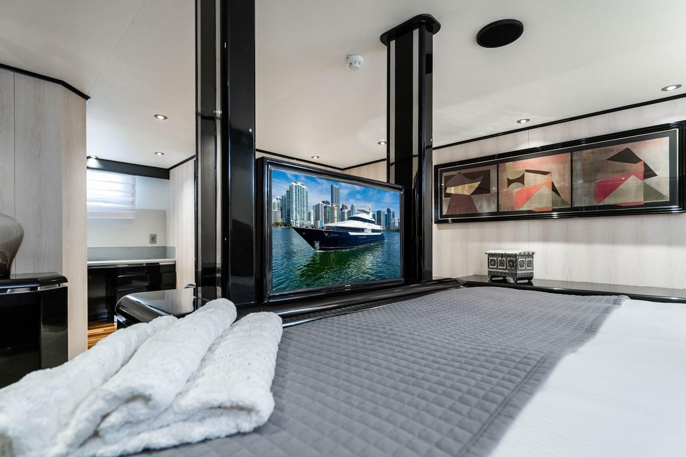 a tv on a wall aboard QUANTUM Yacht for Sale