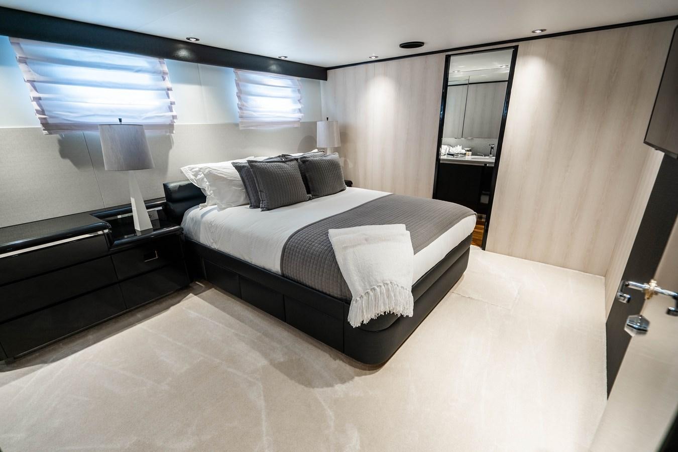 a large bedroom with a large bed aboard QUANTUM Yacht for Sale