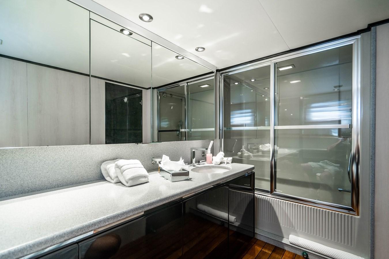 a bathroom with a large mirror aboard QUANTUM Yacht for Sale