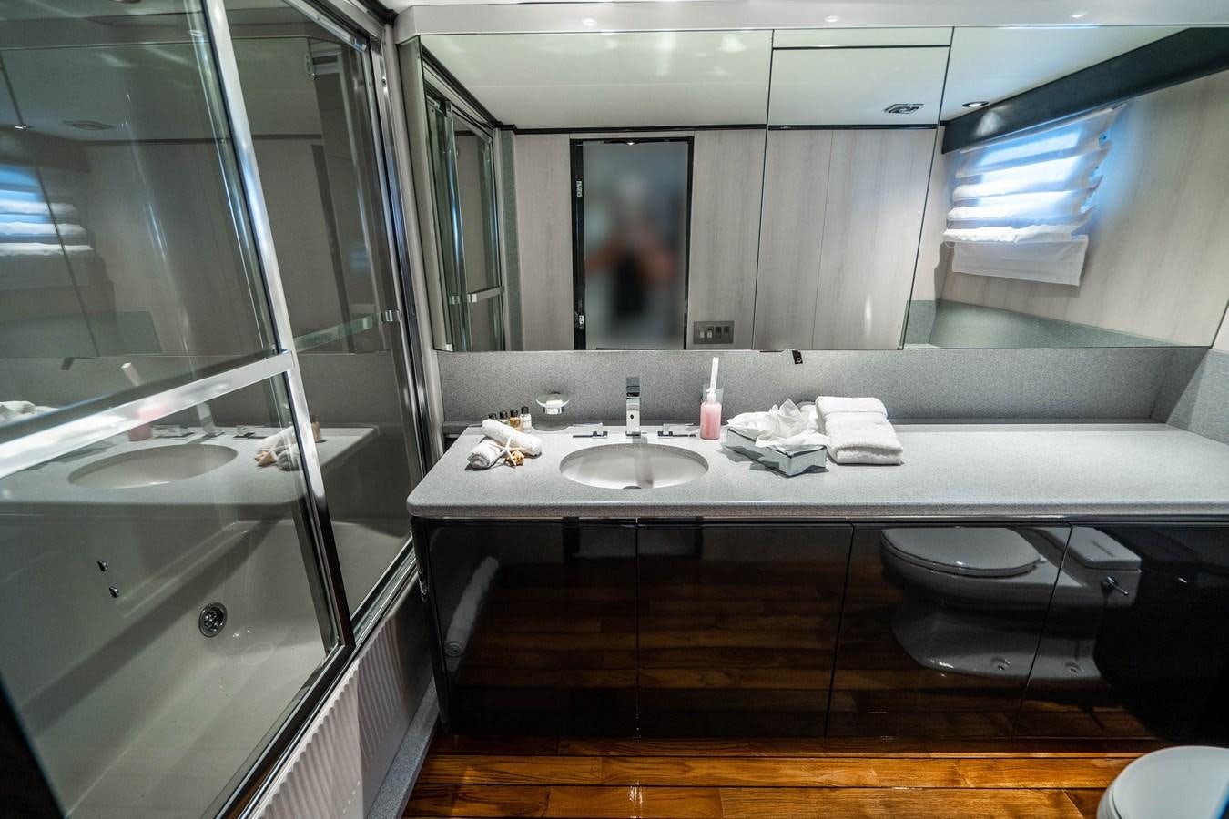 a bathroom with a sink and a mirror aboard QUANTUM Yacht for Sale