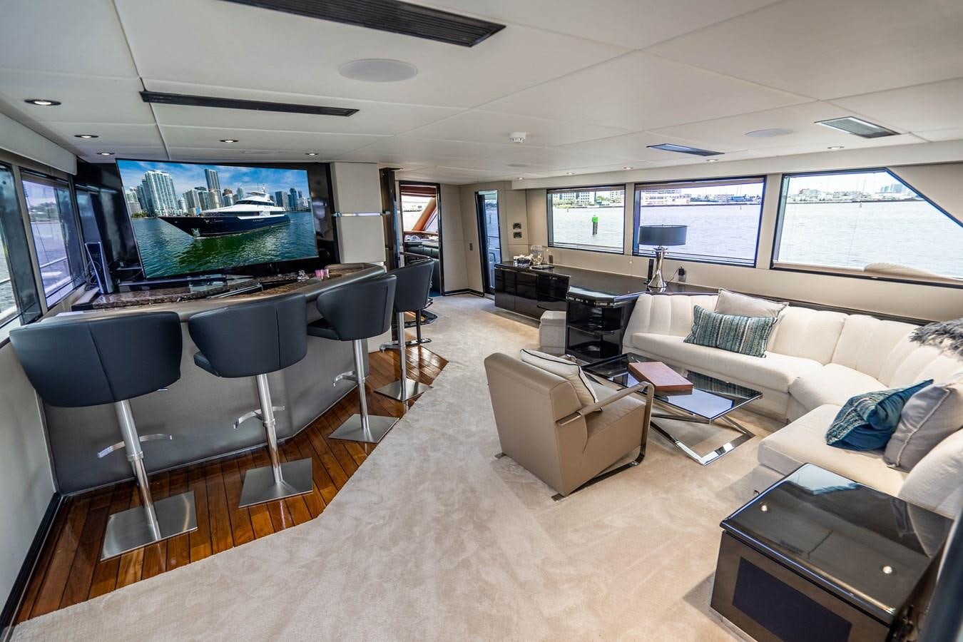 a living room with a large screen aboard QUANTUM Yacht for Sale