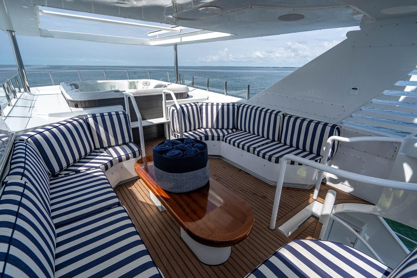 a boat with a table and chairs aboard QUANTUM Yacht for Sale