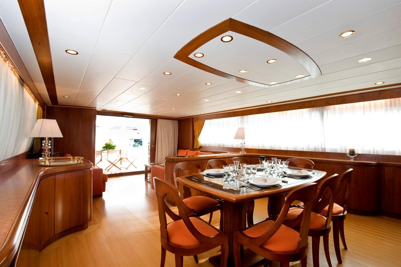 a dining room with a table and chairs aboard WATANGA Yacht for Sale