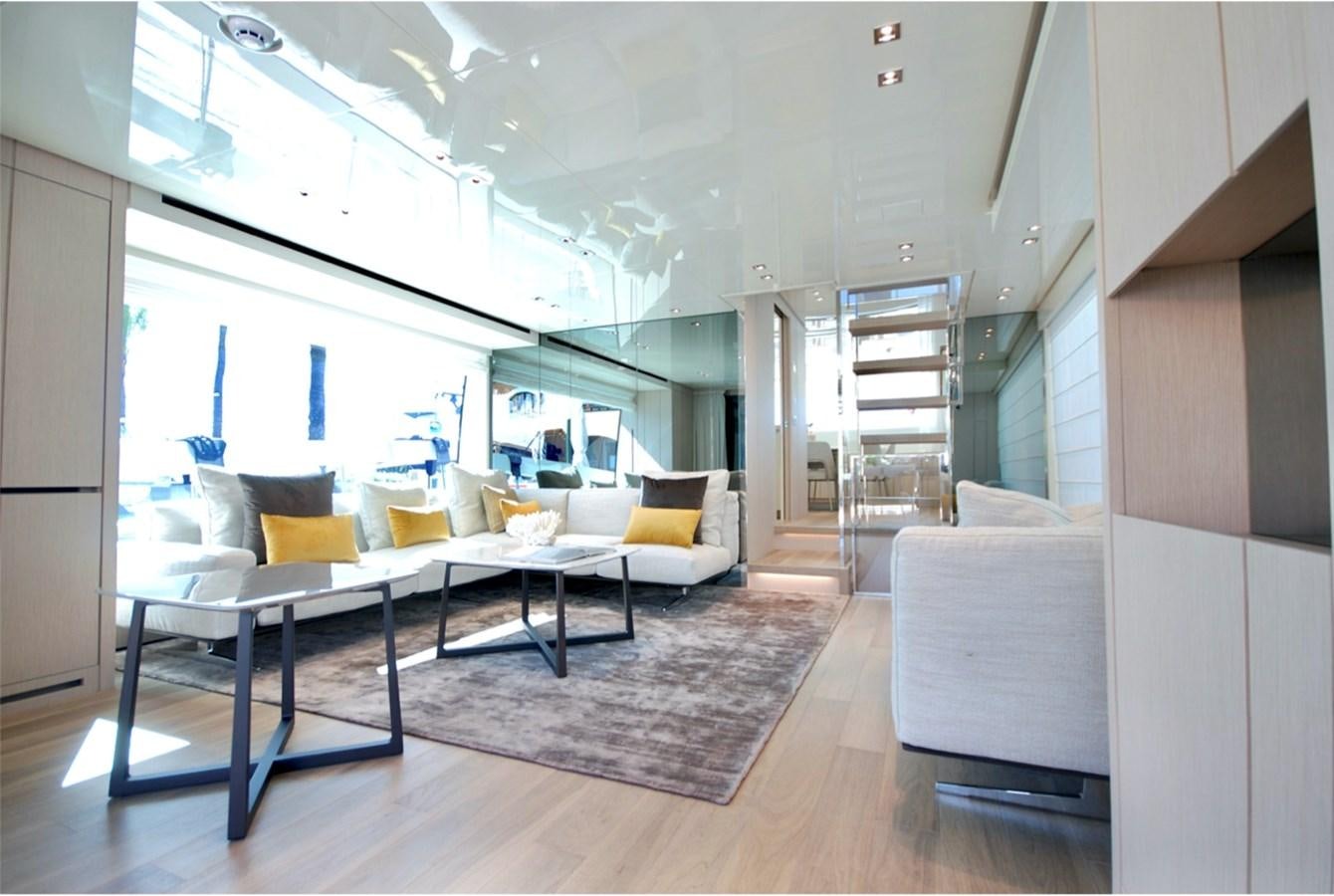 a room with a table and chairs aboard SANLORENZO SX76 Yacht for Sale