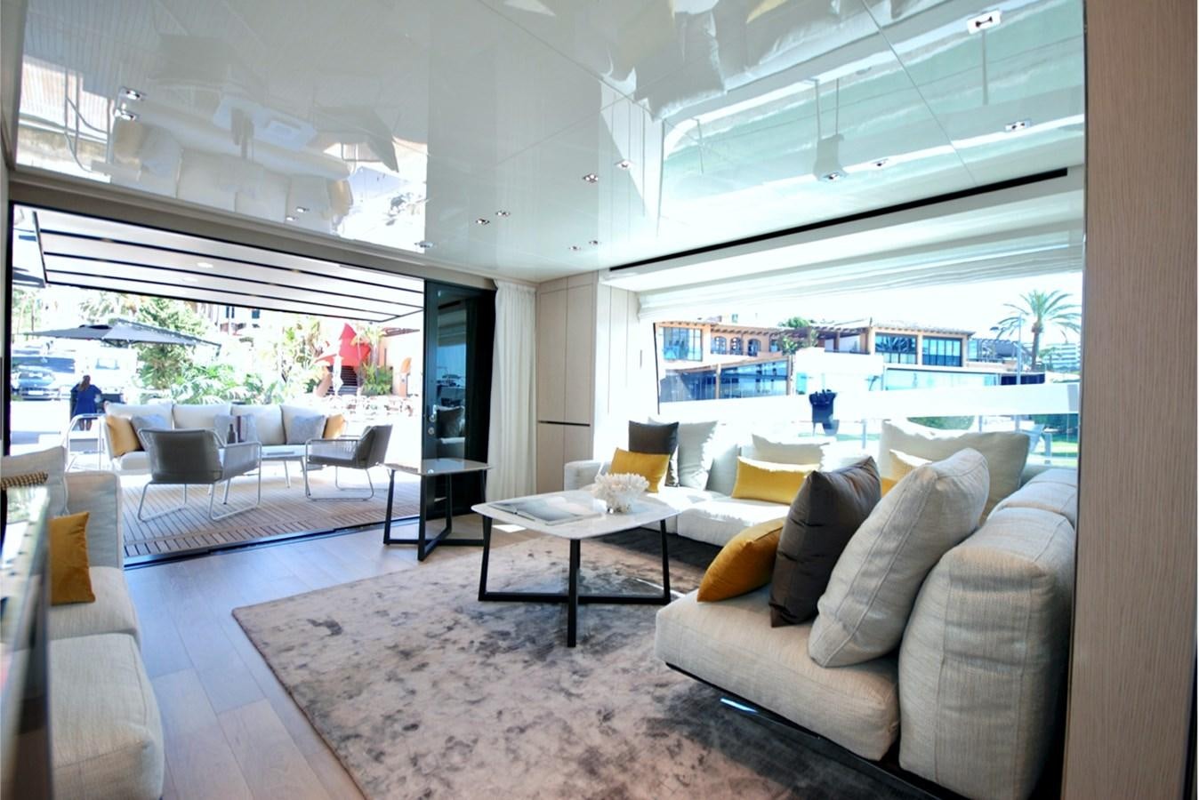 a living room with a large window aboard SANLORENZO SX76 Yacht for Sale