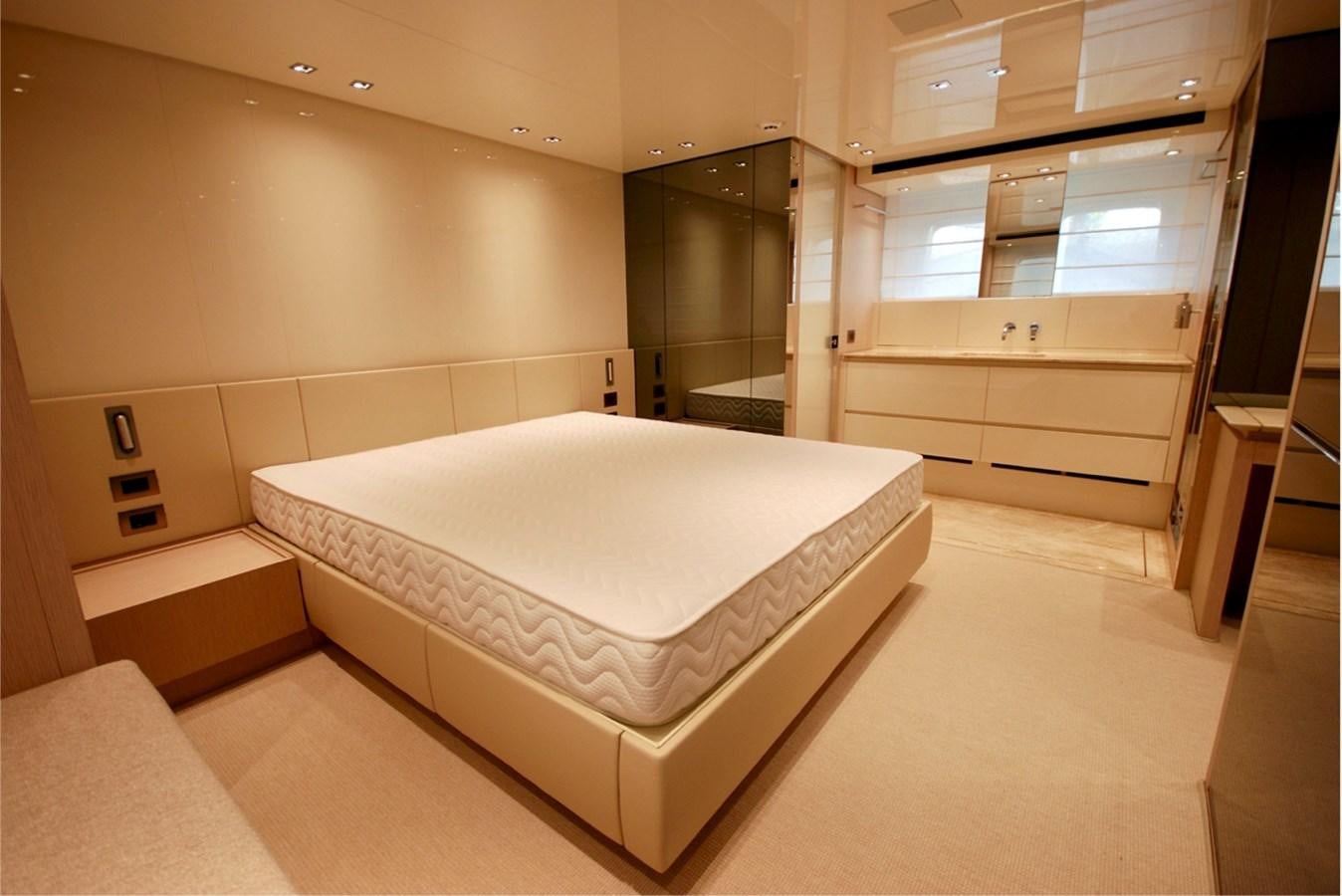 a large white bed in a room aboard SANLORENZO SX76 Yacht for Sale