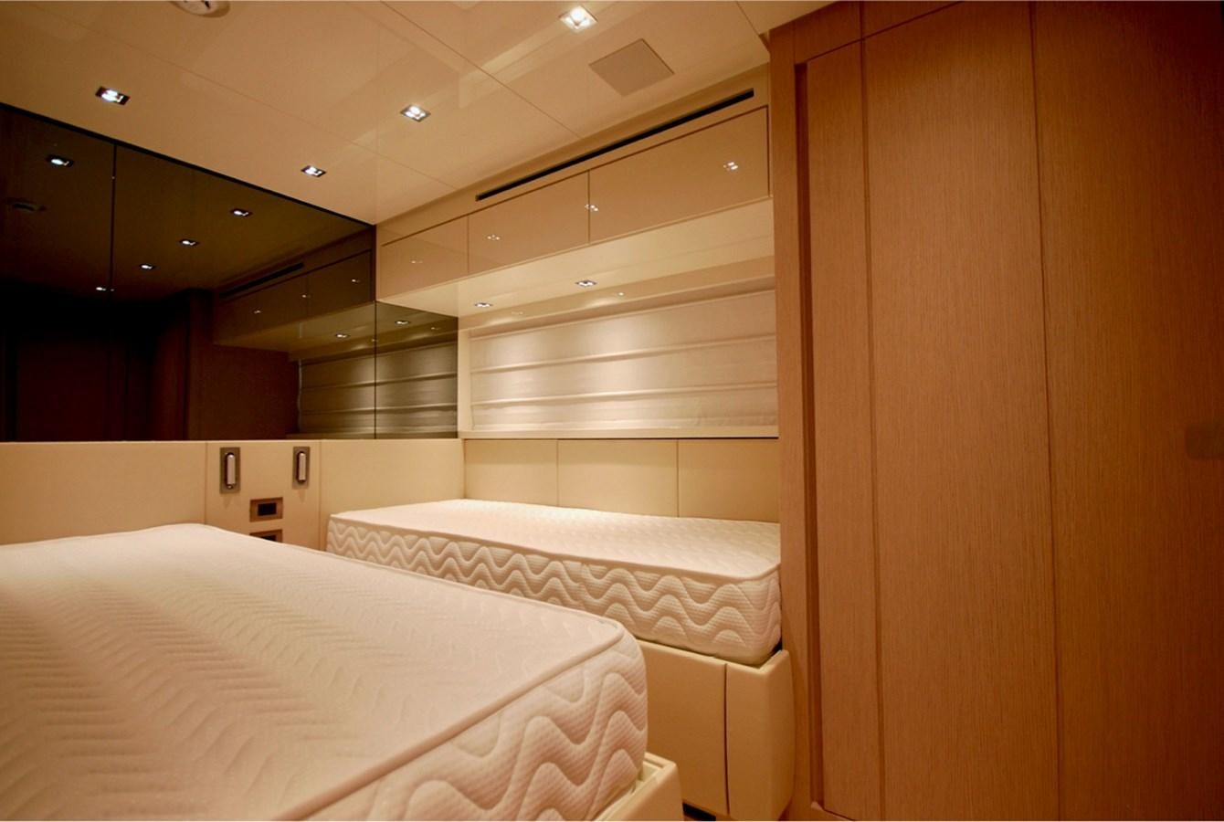 a room with a bed and a closet aboard SANLORENZO SX76 Yacht for Sale