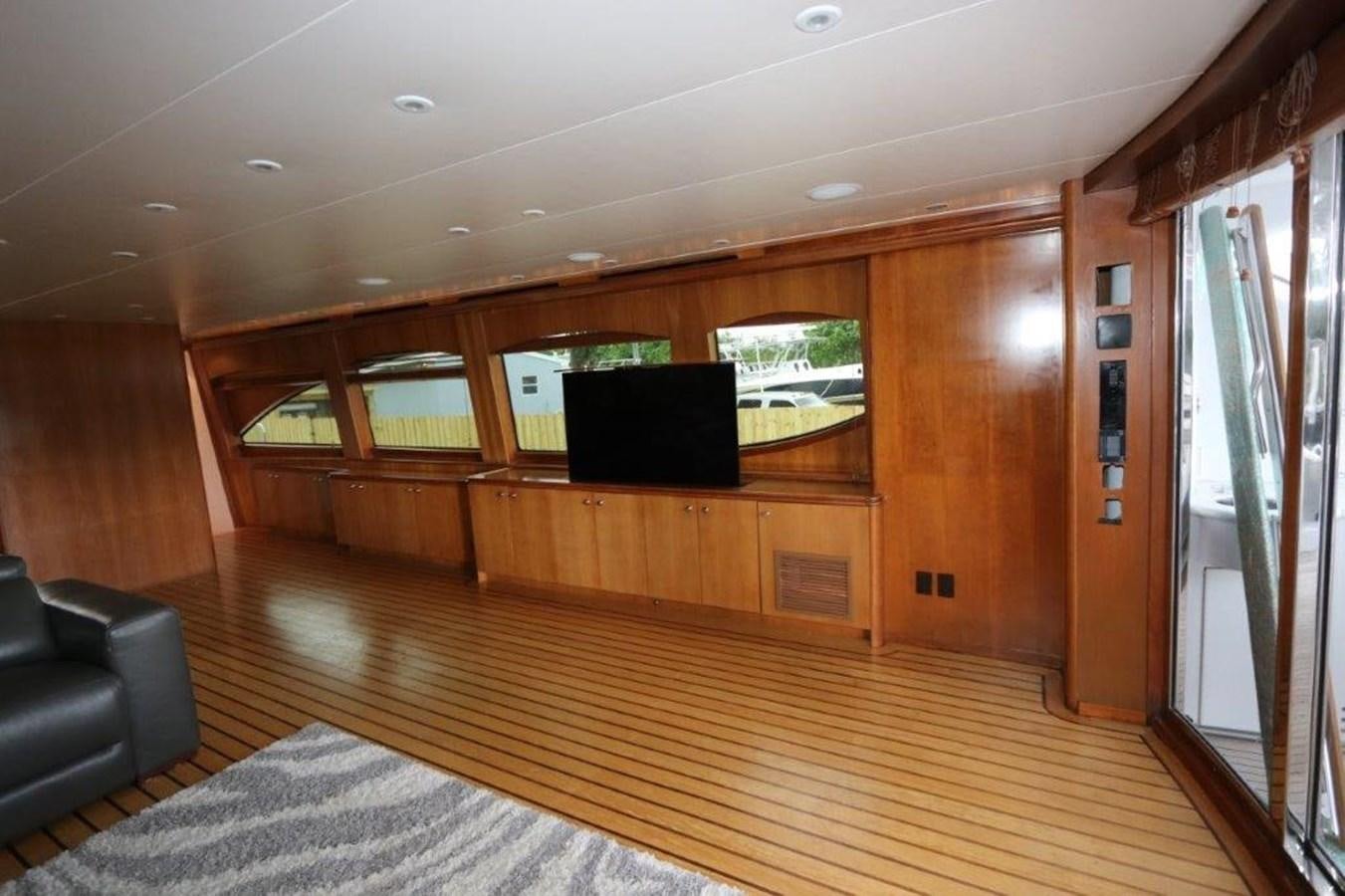 a room with a wood floor and a tv on the wall aboard HATGS618A606 Yacht for Sale