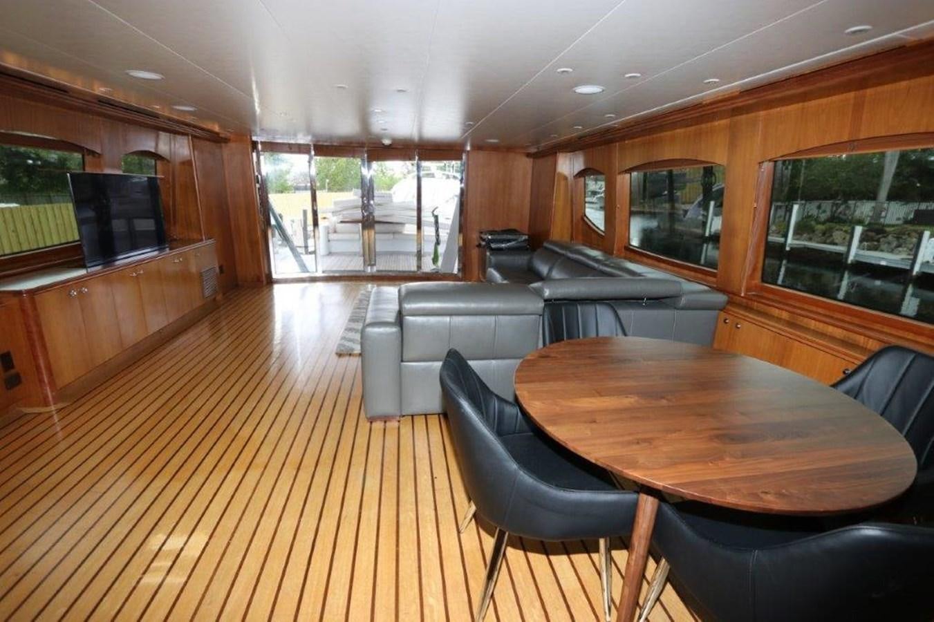 a wood paneled room with a table and chairs aboard HATGS618A606 Yacht for Sale