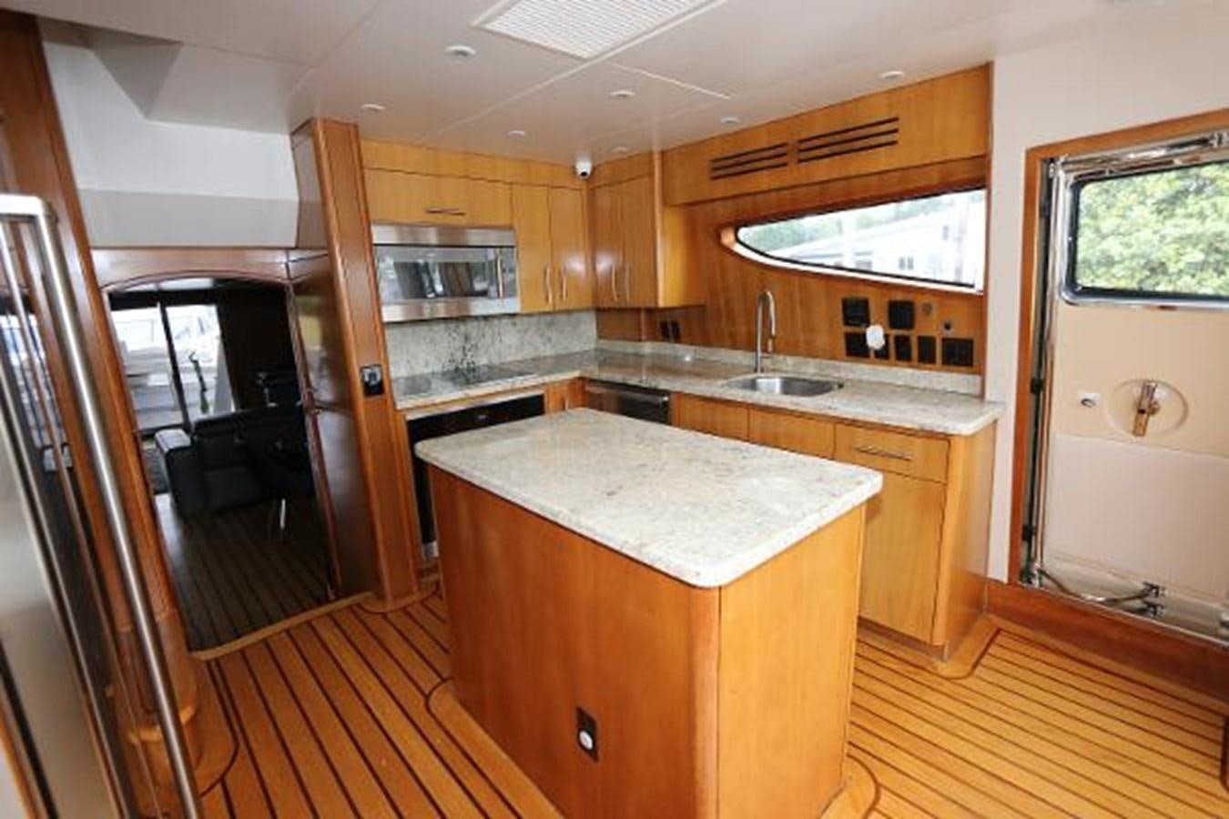a kitchen with wooden cabinets aboard HATGS618A606 Yacht for Sale