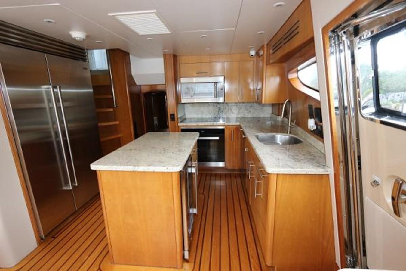 a kitchen with a large island aboard HATGS618A606 Yacht for Sale