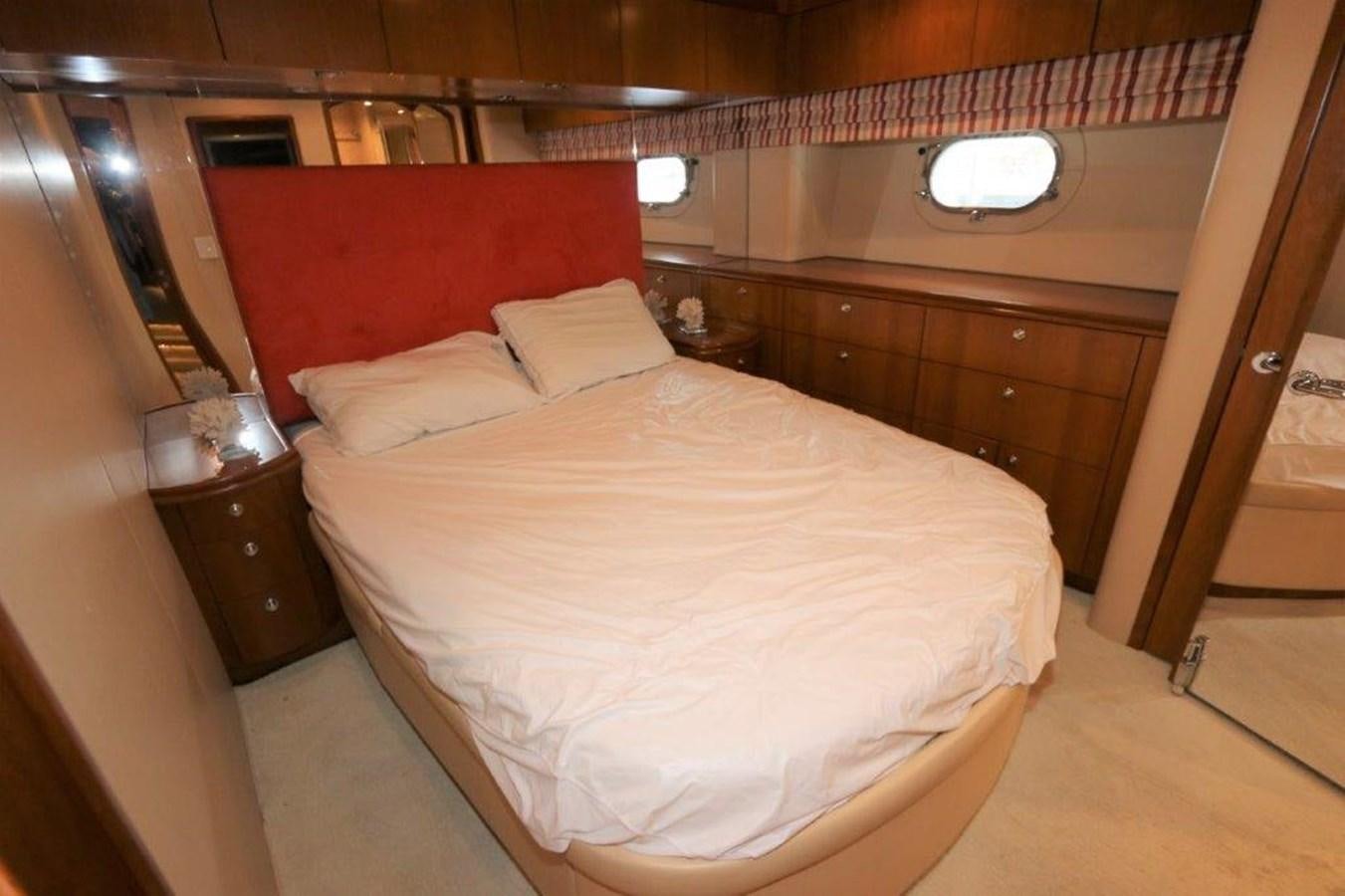 a bed with a red pillow aboard HATGS618A606 Yacht for Sale