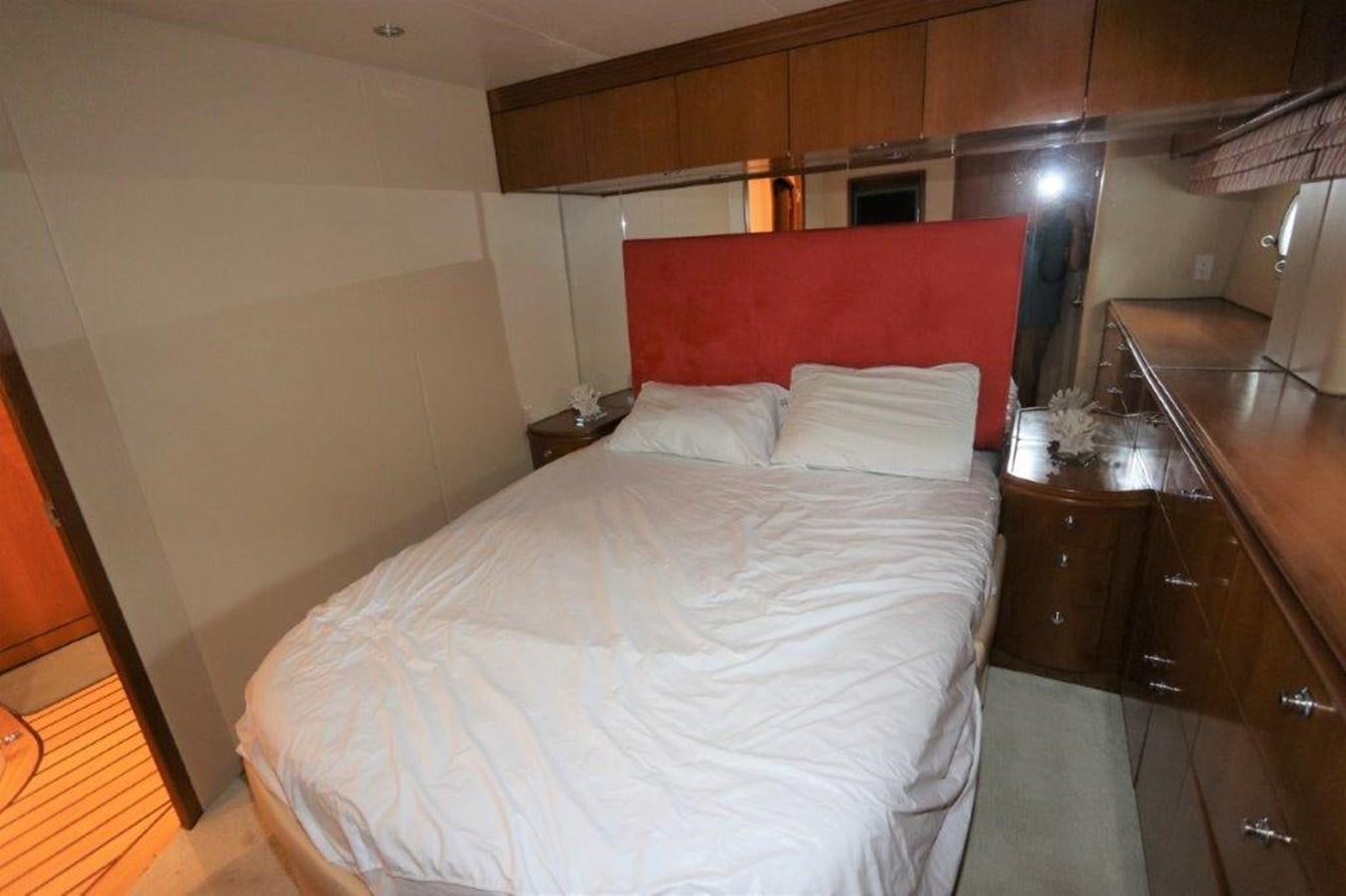 a bed with white sheets aboard HATGS618A606 Yacht for Sale