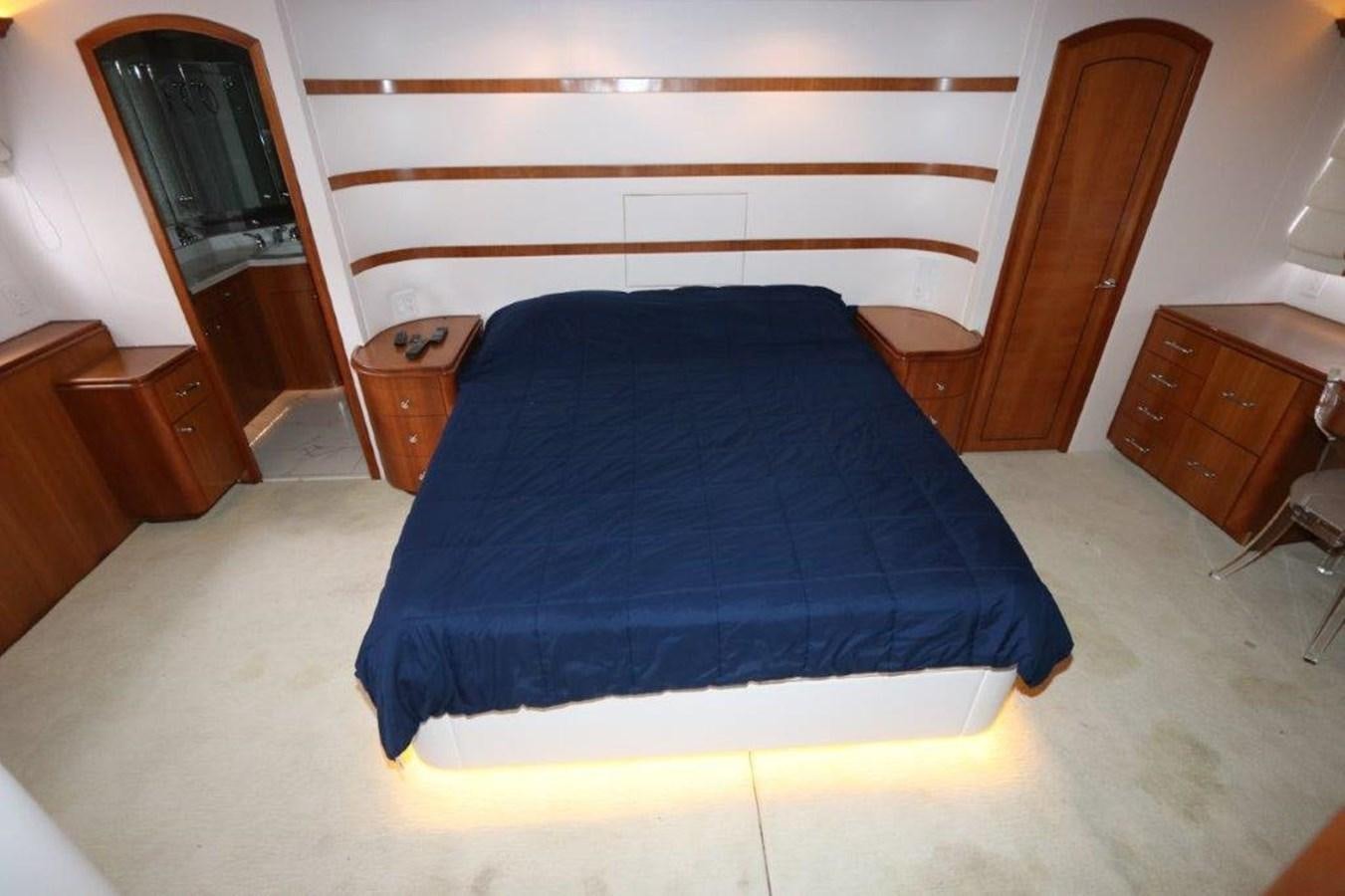 a bed with a blue cover aboard HATGS618A606 Yacht for Sale