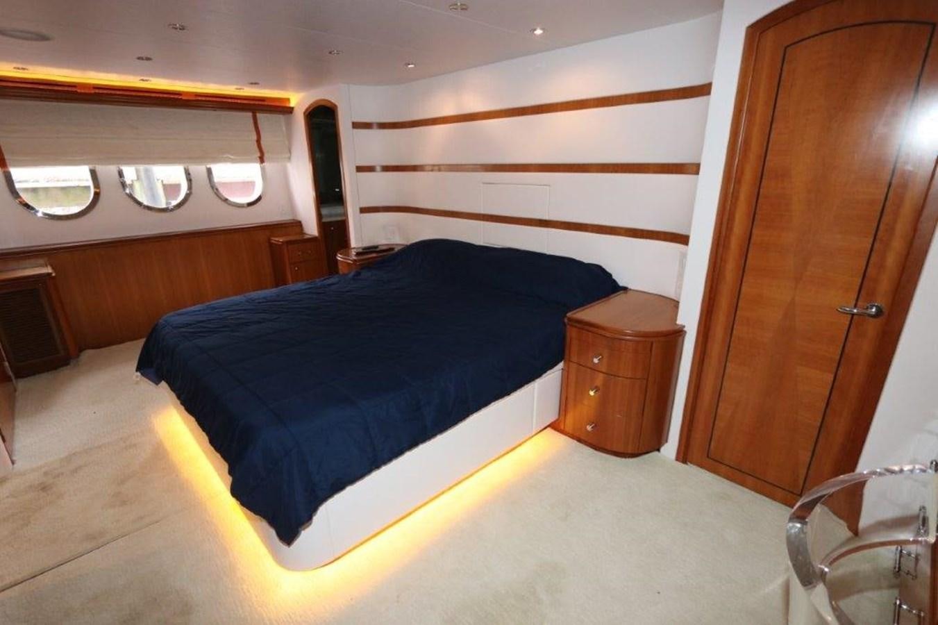 a bedroom with a bed and a dresser aboard HATGS618A606 Yacht for Sale