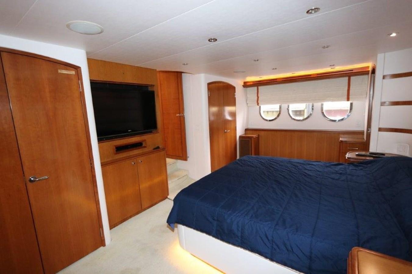 a bedroom with a bed and tv aboard HATGS618A606 Yacht for Sale