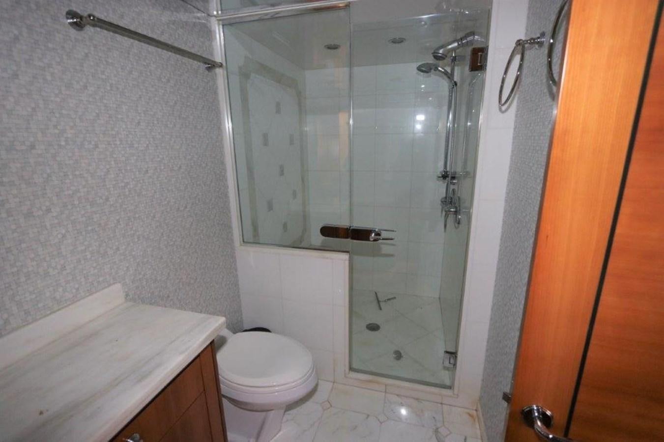 a bathroom with a glass shower aboard HATGS618A606 Yacht for Sale