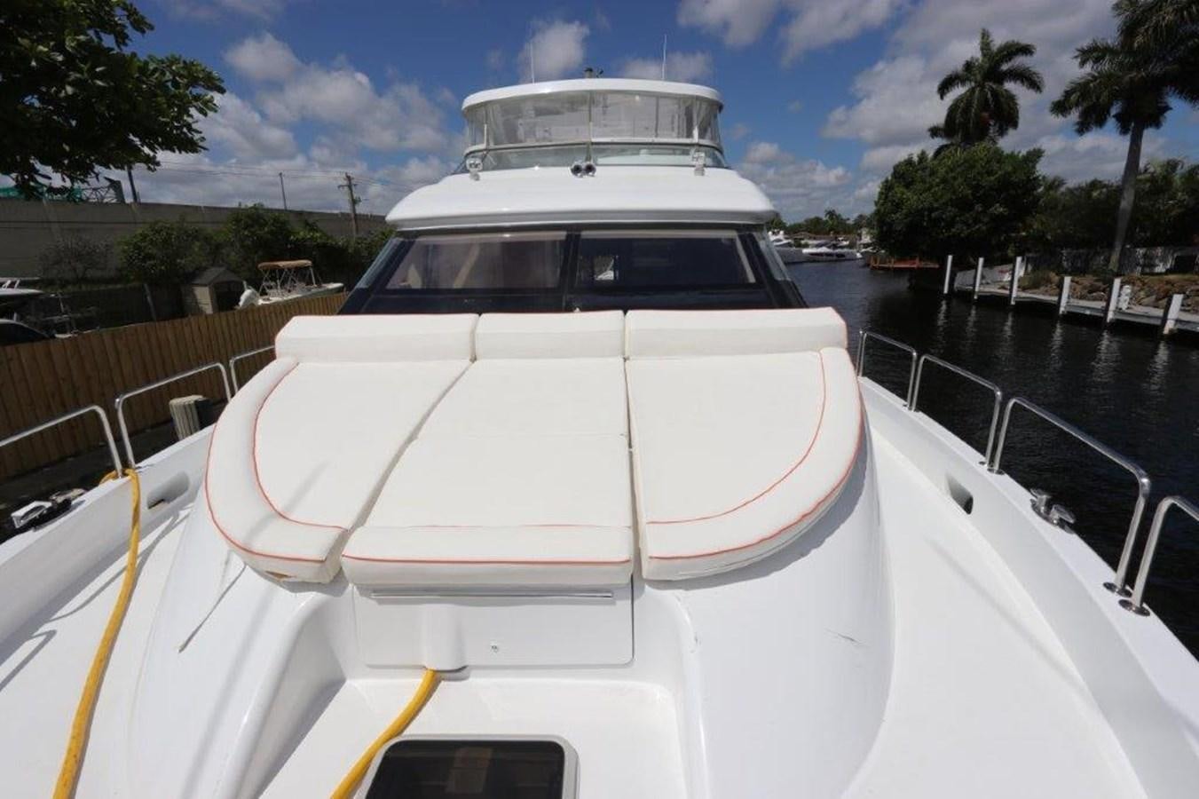 a white boat on a body of water aboard HATGS618A606 Yacht for Sale
