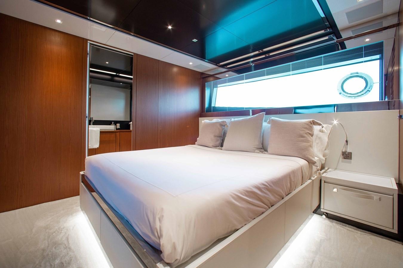 a bed in a room aboard KIYOMIZU Yacht for Sale