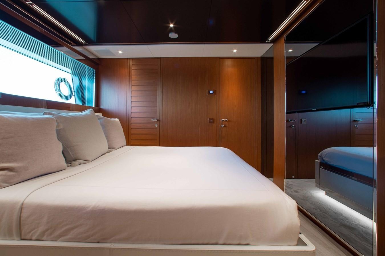 a bed with white sheets aboard KIYOMIZU Yacht for Sale