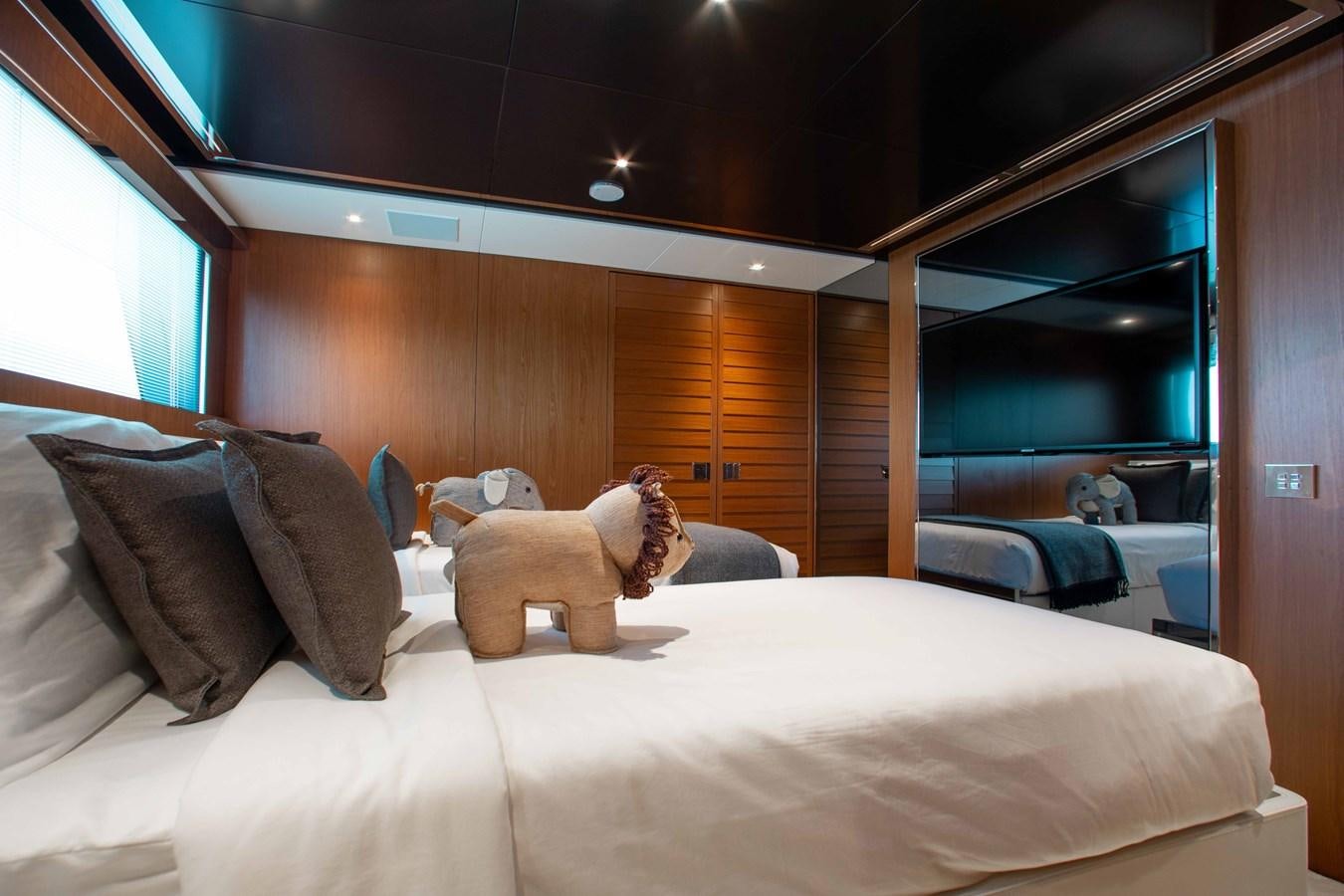 a teddy bear on a bed aboard KIYOMIZU Yacht for Sale
